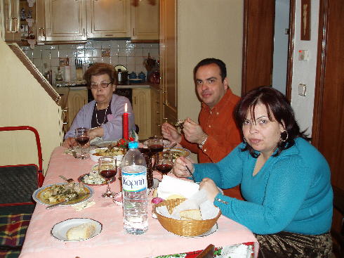 Digging into the New Year's Day lunch with Nitsa, Antonis and Christina