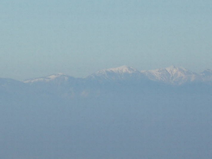The snow-capped peaks of the Belles range, running west to east and forming a natural as well as political border